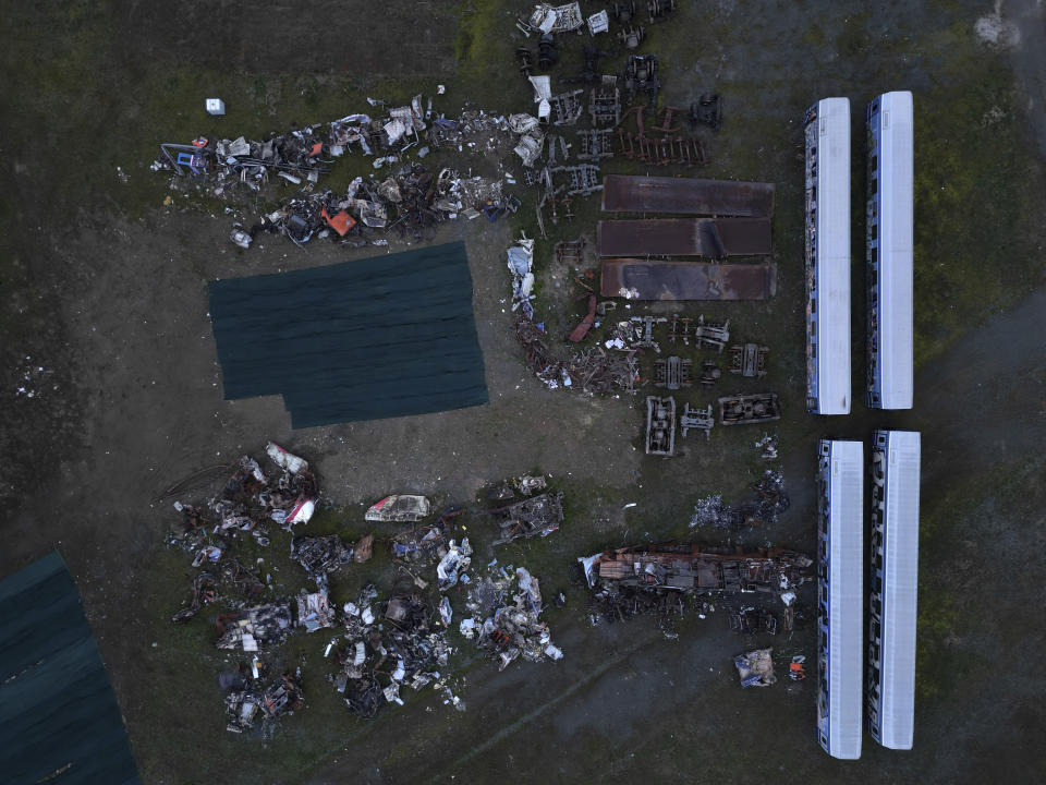 An aerial view of the wagons and other parts recovered from a train wreck, near Larissa city, central Greece, Wednesday, Feb. 28, 2024. Greece’s deadliest rail disaster killed 57 people when a passenger train slammed into an oncoming cargo train. The tragedy shocked the country, with many of the victims being university students. (AP Photo)