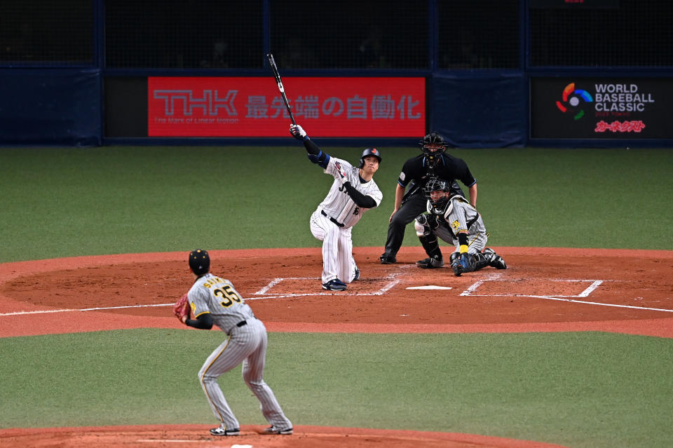 OSAKA, JAPAN - MARCH 06: Designated hitter Shohei Ohtani #16 of Japan hits a three run home run in the third inning during the World Baseball Classic exhibition game between Japan and Hanshin Tigers at Kyocera Dome Osaka on March 6, 2023 in Osaka, Japan. (Photo by Kenta Harada/Getty Images)