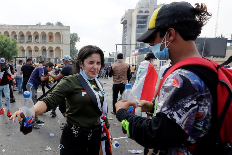 Demonstrators take part in a protest over corruption, lack of jobs, and poor services, in Baghdad