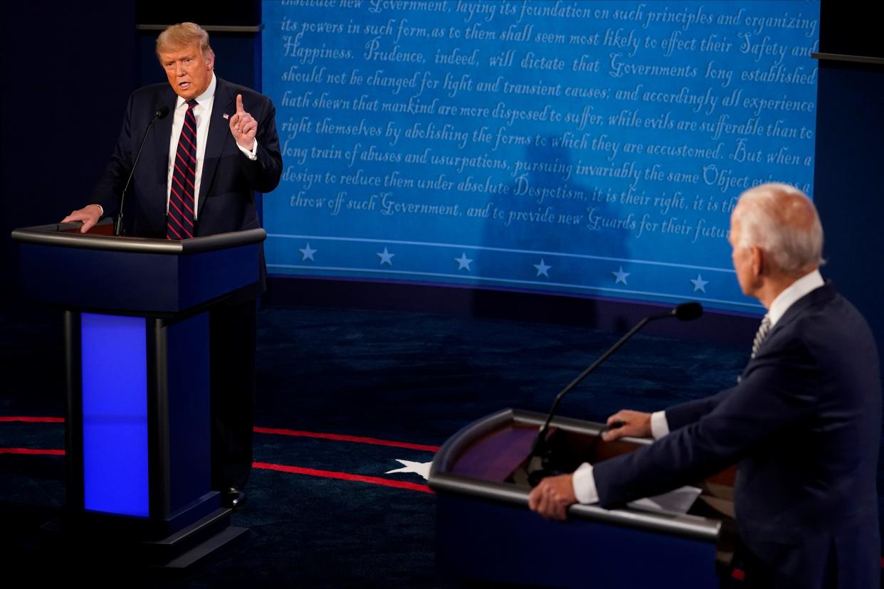 U.S. President Donald Trump and Democratic presidential nominee Joe Biden participate in their first 2020 presidential campaign debate held on the campus of the Cleveland Clinic at Case Western Reserve University in Cleveland, Ohio, U.S., September 29, 2020. Morry Gash/Pool via REUTERS