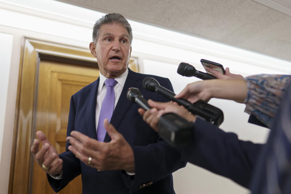 FILE - Sen. Joe Manchin, D-W.Va., talks with reporters on Capitol Hill in Washington, July 21, 2022. Senate Majority Leader Chuck Schumer and Manchin secreted themselves in a basement room at the Capitol. The two men had been wrestling for more than a year in long, failed rounds of start-and-stop negotiations over President Joe Biden's big rebuilding America package. But talks had jammed up — again. With the midterm elections near, control of Congress at stake, the president and his party were at the end of the line. (AP Photo/J. Scott Applewhite, File)