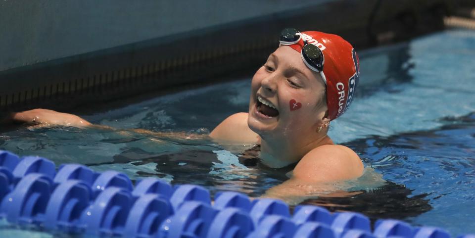 Sacred Heart’s Charlotte Crush races and wins in the 100 butterfly Saturday at the KHSAA State Championships.