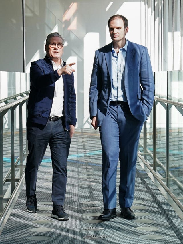 Labour Party leader Sir Keir Starmer welcomes MP and psychiatrist Dr Dan Poulter to the Labour Party at the Francis Crick Institute, north London 