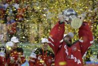 Canada's goaltender Mike Smith holds the trophy during the victory ceremony of the Ice Hockey World Championship final game at the O2 arena in Prague, Czech Republic May 17, 2015. REUTERS/David W Cerny