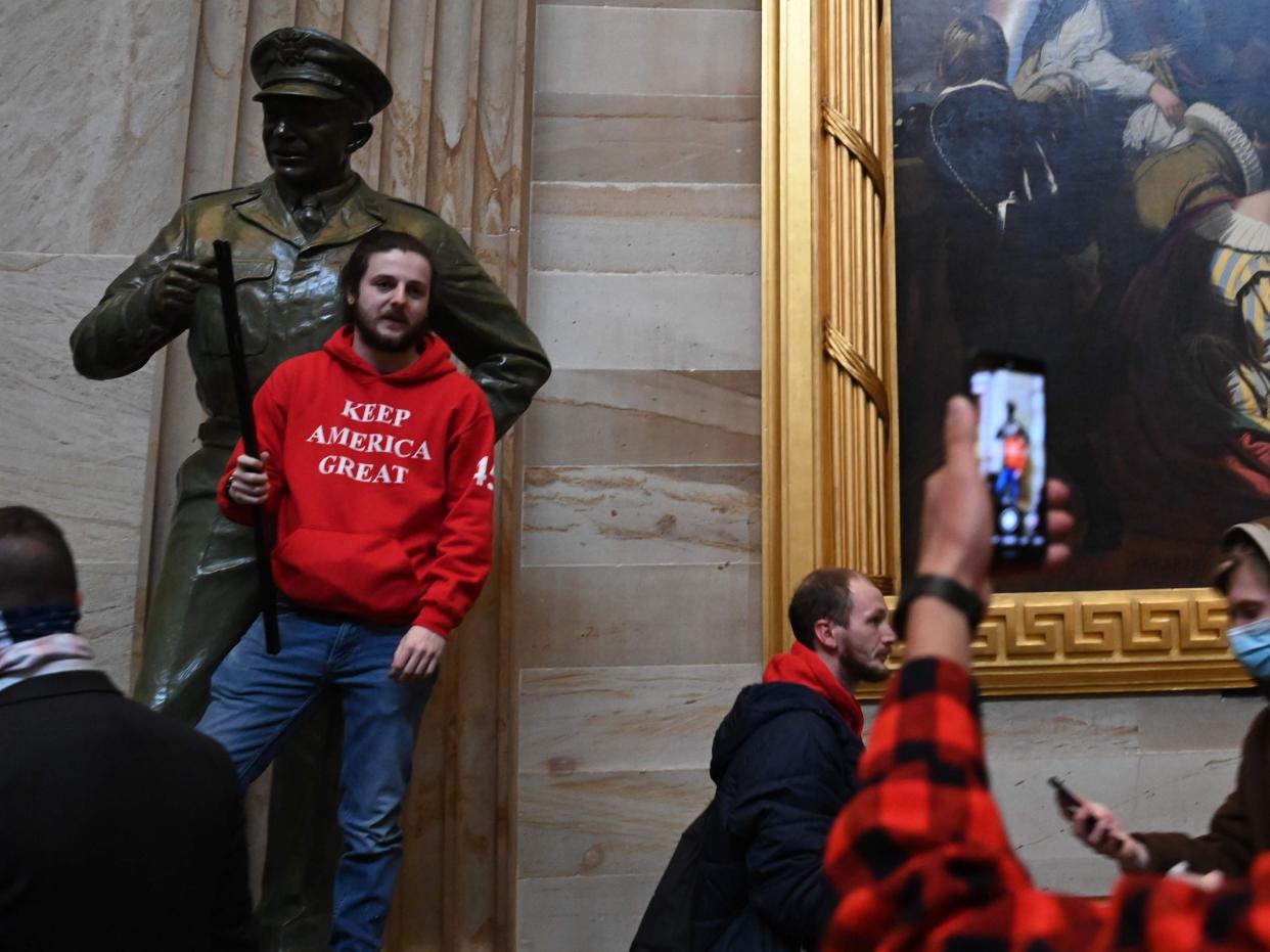 <p>Supporters of US President Donald Trump enter the US Capitol’s Rotunda on 6 January 6, 2021 in Washington, DC</p> ((AFP via Getty Images))