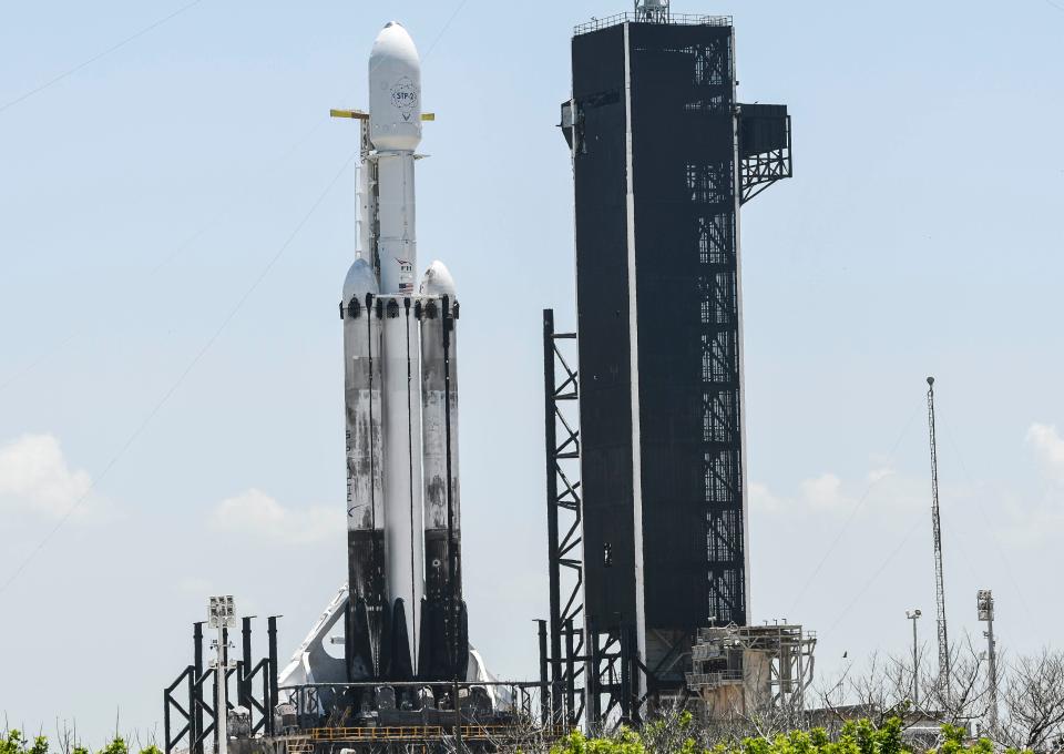 A SpaceX Falcon Heavy rocket sits poised on Pad 39A at Kennedy Space Center Monday, June 24, 2019.  The rocket, set for liftoff late tonight, is carrying multiple payloads for the DoD and NASA.