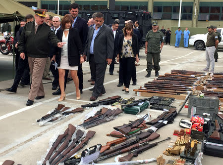 FILE PHOTO: Argentina's Security Minister Patricia Bullrich looks at weapons and ammunition that were seized by Argentine authorities in a container coming from the United States, at the Argentine gendarmerie headquarters in Buenos Aires, Argentina November 5, 2018. REUTERS/Miguel Lo Bianco/File Photo