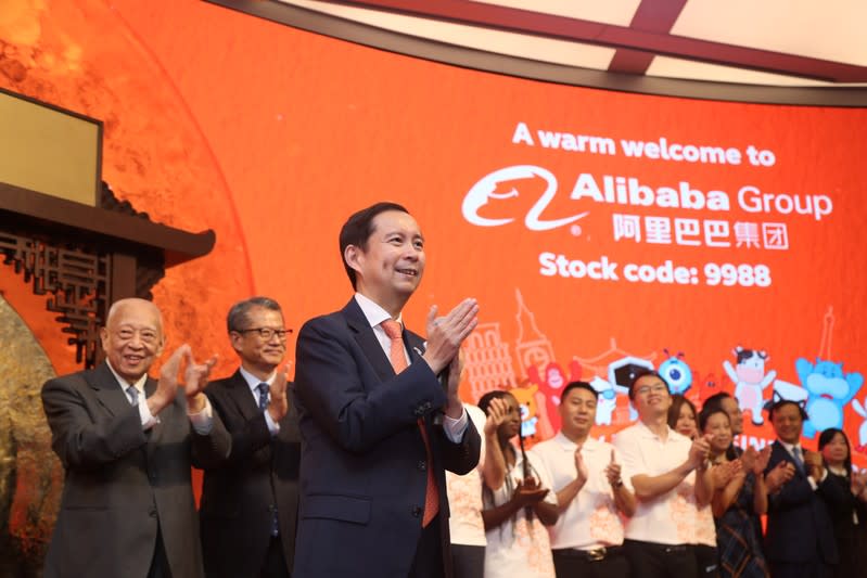 Daniel Zhang, Paul Chan and Tung Chee-hwa attend Alibaba Group's listing ceremony at the Hong Kong Stock Exchange (HKEX) in Hong Kong