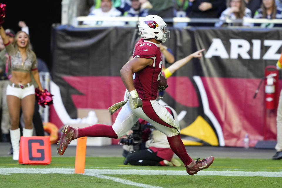 Arizona Cardinals linebacker Zaven Collins returns an interception for a touchdown during the second half of an NFL football game against the Seattle Seahawks in Glendale, Ariz., Sunday, Nov. 6, 2022. (AP Photo/Matt York)