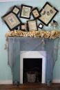 <p>Gina Luker of The Shabby Creek Cottage made this budget-friendly look using dollar store finds, old book pages (see her DIY dictionary print candles), and an arrangement of lopsided picture frames. <br></p><p><strong>See more at <a href="http://www.theshabbycreekcottage.com/2011/10/day-7-halloween-mantle-mantel.html" rel="nofollow noopener" target="_blank" data-ylk="slk:The Shabby Creek Cottage;elm:context_link;itc:0;sec:content-canvas" class="link ">The Shabby Creek Cottage</a>.</strong> </p>