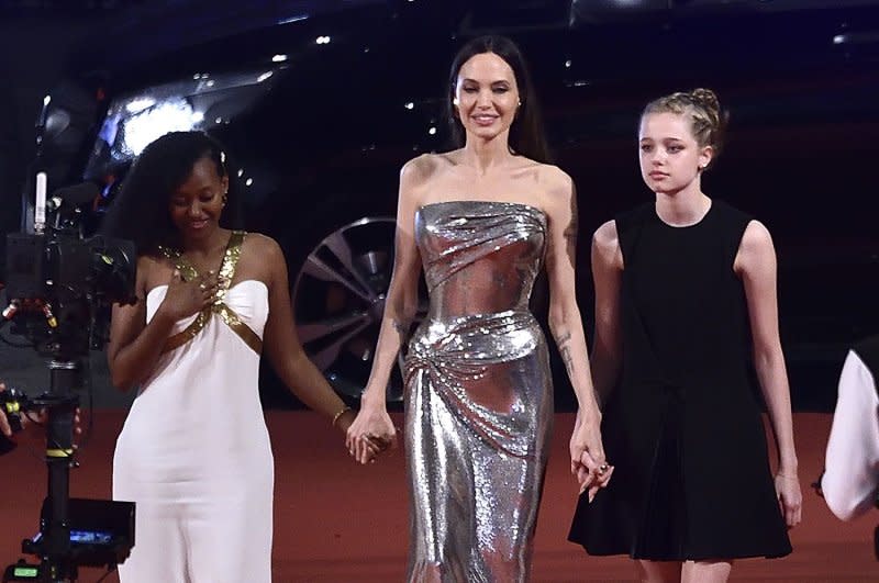 Angelina Jolie (C), accompanied by her daughters Zahara (L) and Shiloh (R), walk the red carpet at the "Eternals" movie premiere during Rome Film Fest 2021. File Photo by Rocco Spaziani/UPI