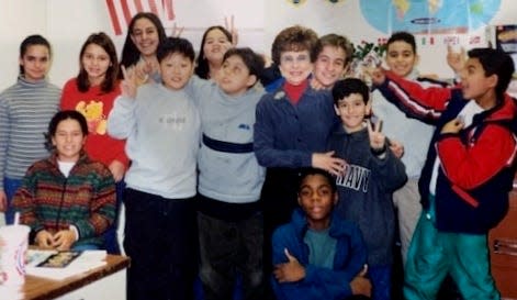 Peg Fasino, center, with her students in Weymouth's English as a Second Language program, which she developed in the 1980s and 1990s.