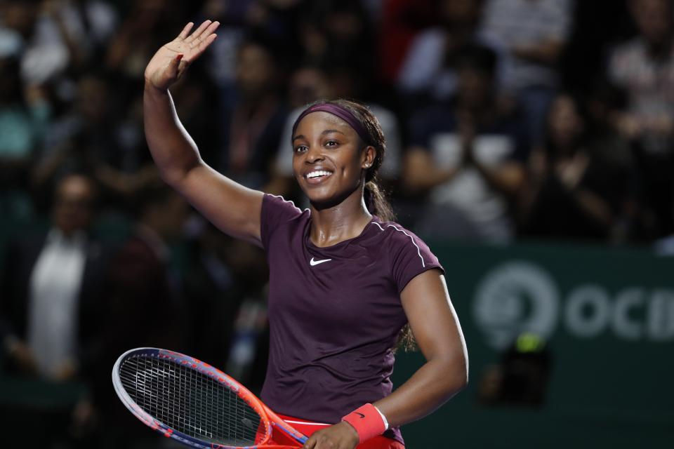 Sloane Stephens of the United States waves to the crowd after beating Naomi Osaka of Japan in their women's singles match at the WTA tennis tournament in Singapore on Monday, Oct. 22, 2018. (AP Photo/Vincent Thian)