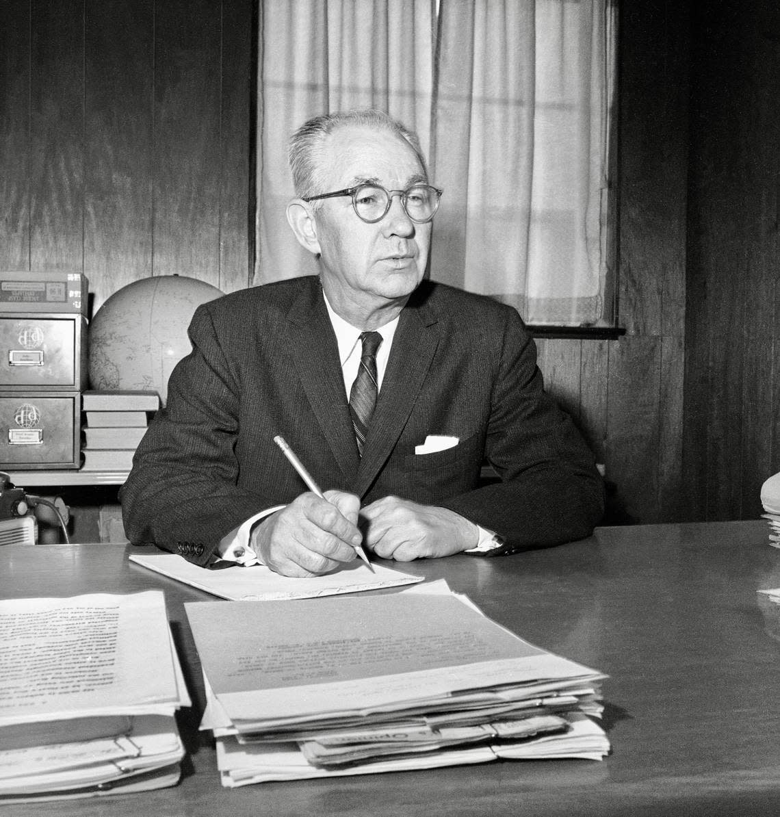 Robert Welch, founder and head of the John Birch Society, an anti-government group that campaigns against communism, is pictured in his Belmont, Mass., office, April 1, 1961. (AP Photo)