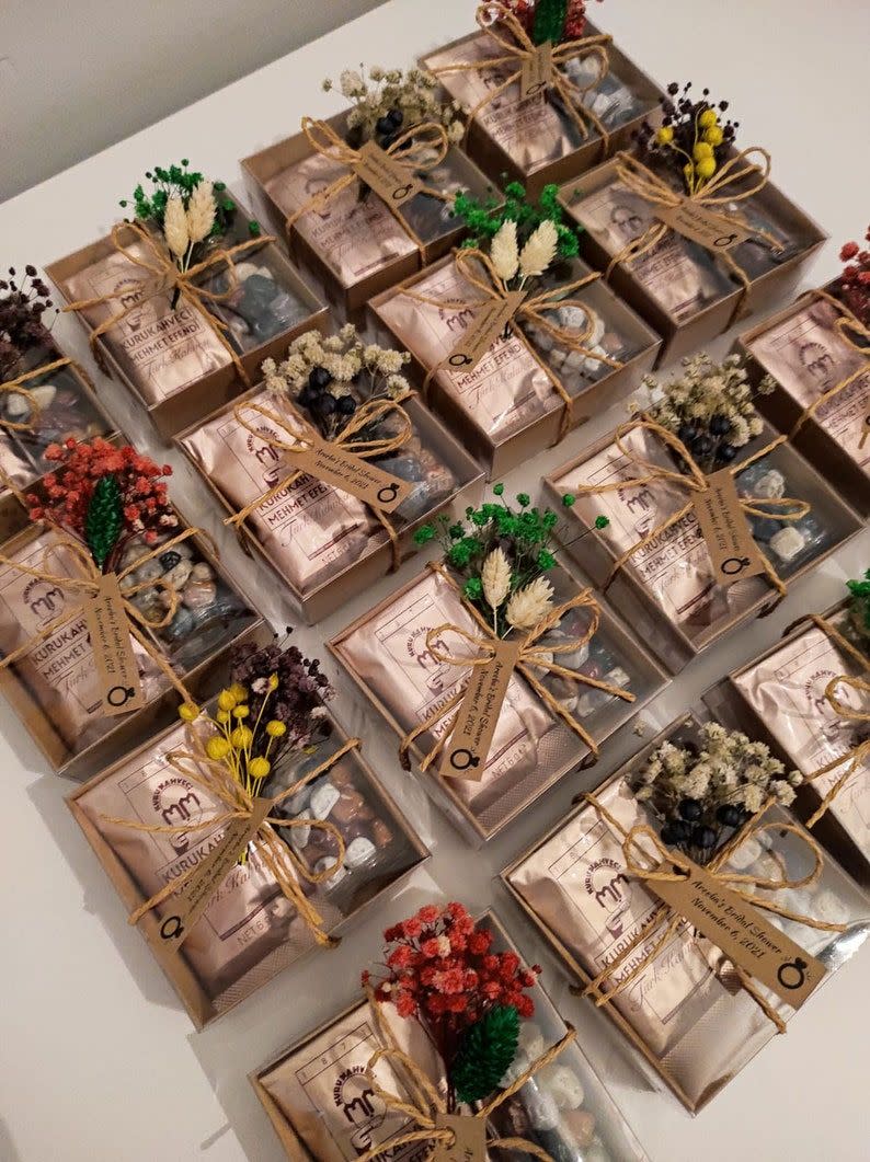 <p><strong>WeddingfavorsdiyCO</strong></p><p>etsy.com</p><p><strong>$2.40</strong></p><p>Coffee and chocolate make a great combination. With this purchase, choose from four flower options (or use a mix) and 15 personalized tags. While this small pack of Turkish coffee and pebble chocolates makes a cute wedding favor, gift them for the holidays and customize the tag with the giftee's name and date of birth. </p>