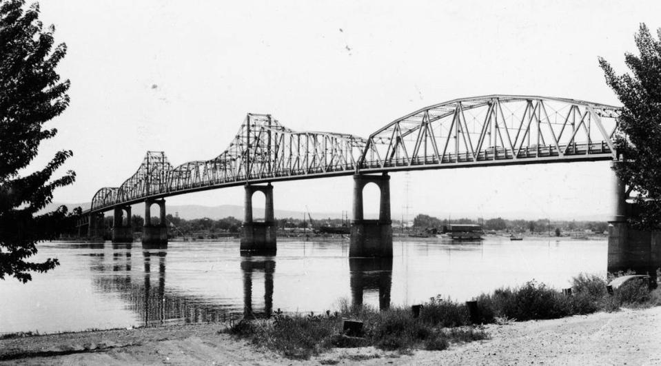 A 1948 view of the green bridge over the Columbia River linking Kennewick and Pasco, which was built in 1922 to complete the northern route of the trancontinental highway from the east to west coast.