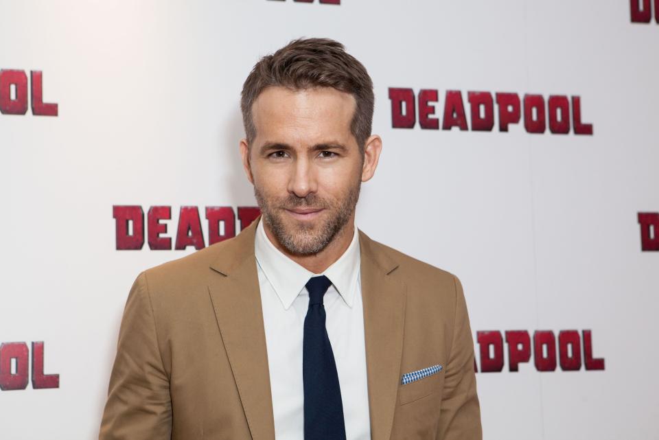 FILE - In a Oct. 28, 2016 file photo, actor Ryan Reynolds poses for photographers upon arrival at a fan screening of the film ‘Deadpool’, in central London. Reynolds will be watching Sunday’s Super Bow, he’s just not sure which team he wants to win. The Canadian actor said he’s a fan of both the Carolina Panthers and Denver Broncos.(Photo by Grant Pollard/Invision/AP, File)