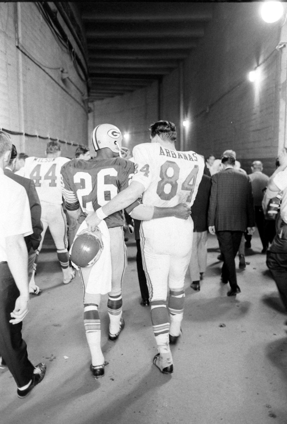 The Packers' Herb Adderley and Kansas City's tight end Fred Arbanas head to the lockers after Green Bay's 35-10 victory.<span class="copyright">Bill Ray—The LIFE Picture Collection/Shutterstock</span>