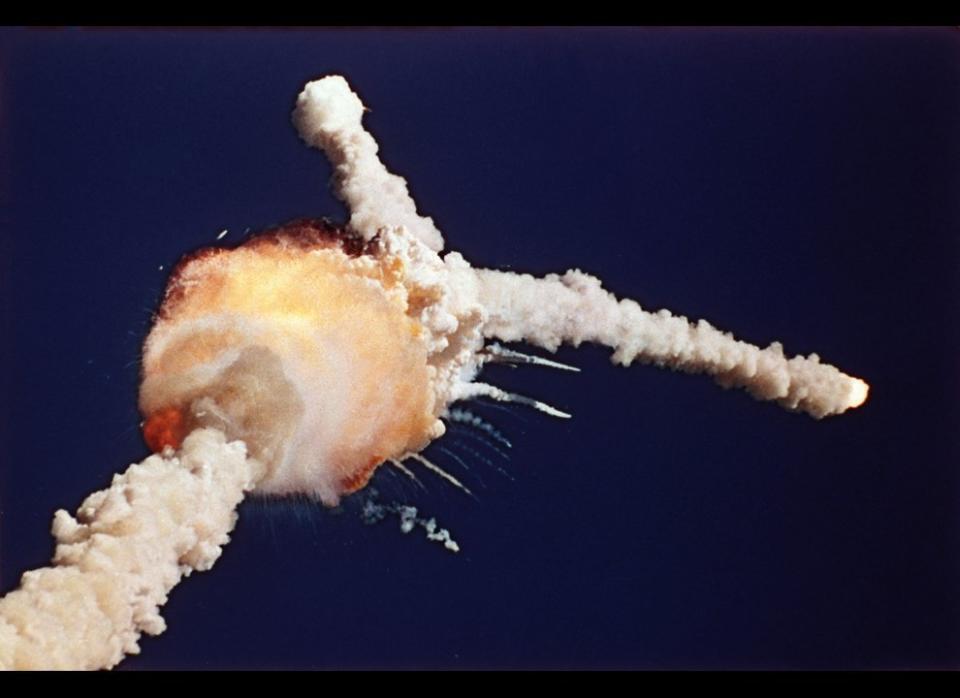 This photograph of the Space Shuttle Challenger exploding 73 seconds after lifting off from the Kennedy Space Center launch pad became the iconic image of a national tragedy. Bruce Weaver/AP. (<a href="http://www.boston.com/bigpicture/2011/01/challenger_disaster_25_years_l.html" target="_hplink">Via the Big Picture</a>)