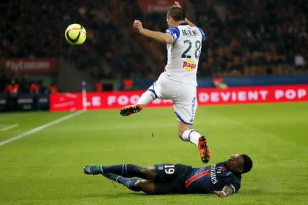 Football Soccer - Paris St Germain vs Bastia - French Ligue 1 - Parc des Princes, Paris, France - 8/1/16. Paris St Germain's Serge Aurier in action with Bastia's Florian Marange REUTERS/Gonzalo Fuentes