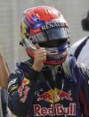 Red Bull Formula One driver Sebastian Vettel of Germany celebrates taking the pole position in the qualifying session of the Italian F1 Grand Prix at the Monza circuit September 7, 2013. REUTERS/Max Rossi (ITALY - Tags: SPORT MOTORSPORT F1)