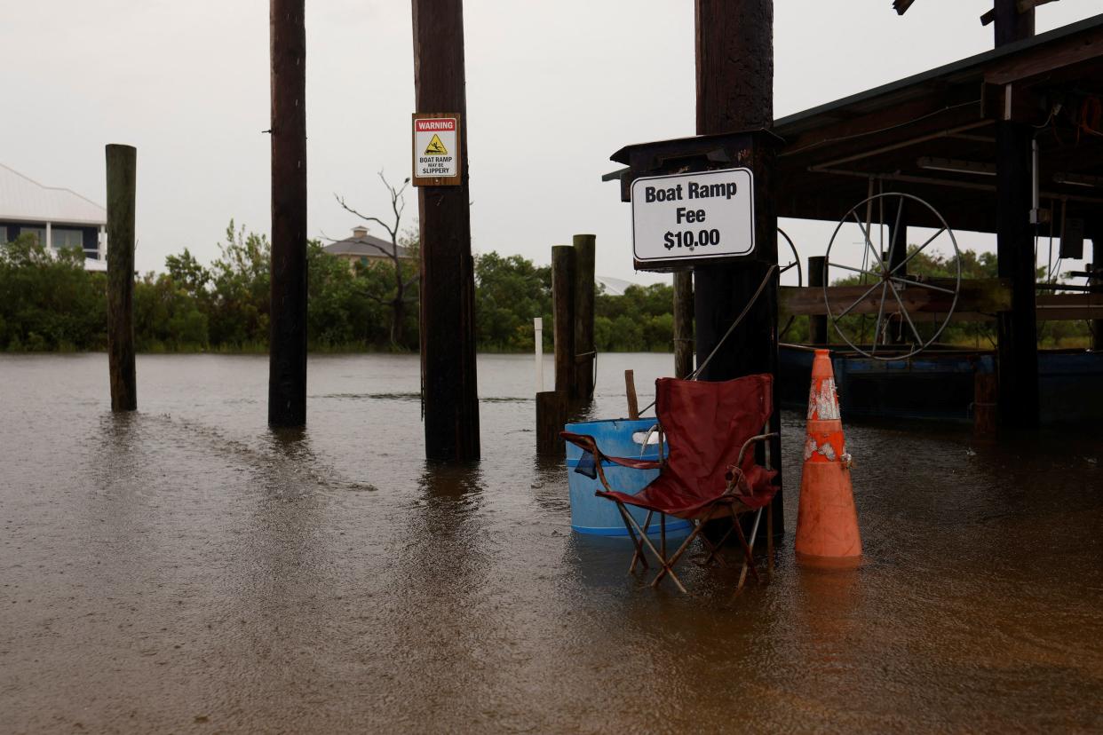 Storm surge begins to flood the docks of Campo’s Marina just before Hurricane Francine made landfall on the U.S. Gulf Coast in Louisiana on September 11, 2024. REUTERS/Edmund Fountain