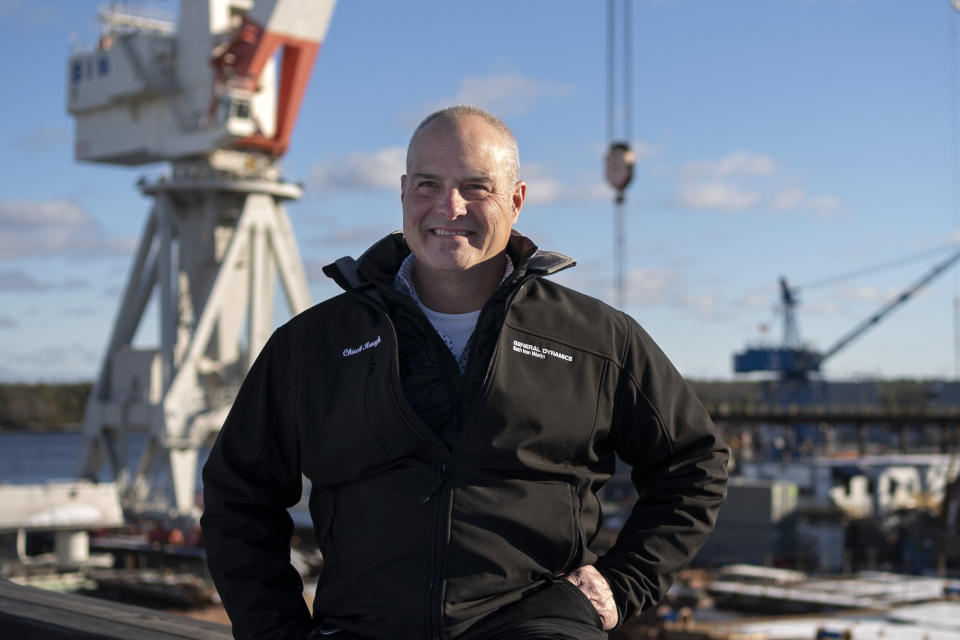 Charles F. Krugh, president of Bath Iron Works, poses at the shipyard Tuesday, Dec. 20, 2022, in Bath, Maine. The former Gulfstream Areospace executive and U.S. Army veteran oversees a workforce that builds destroyers for the Navy. (AP Photo/Robert F. Bukaty)