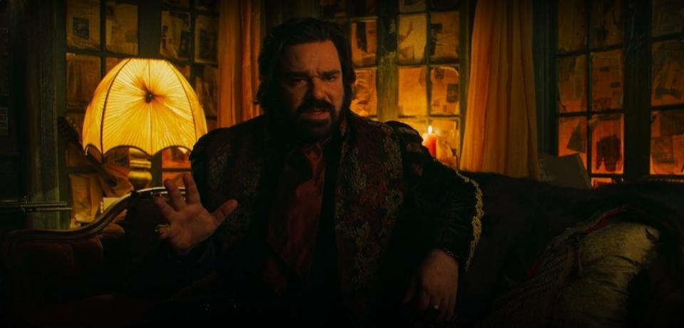 Laszlo talking to the camera in the fancy room in "What We Do in the Shadows"