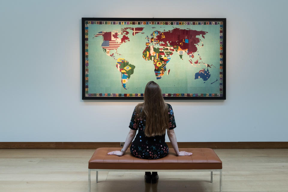 <p>LONDON, UNITED KINGDOM - OCTOBER 08, 2021: A staff member looks at an artwork by Alighiero Boetti (1940-1994) 'Mappa', 1988-89, estimate: £ 1,200,000 - 1,800,000 during a press preview of 20th/21st Century: Evening Sale at Christie's auction house on October 08, 2021 in London, England. (Photo credit should read Wiktor Szymanowicz/Barcroft Media via Getty Images)</p>
