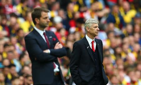 Arsenal manager Arsene Wenger and Aston Villa manager Tim Sherwood. Reuters / Eddie Keogh