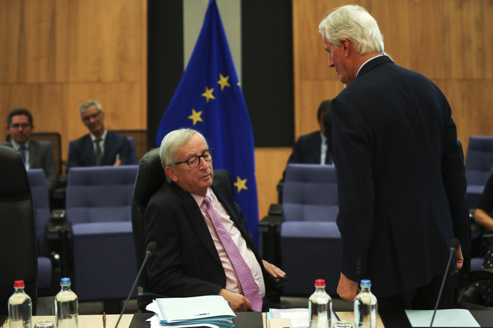 European Commission President Jean-Claude Juncker, left, talks to European Union chief Brexit negotiator Michel Barnier during a weekly meeting of the College of Commissioners at EU headquarters in Brussels, Wednesday, Oct. 2, 2019. British Prime Minister Boris Johnson was due to send to Brussels what he says is the U.K.'s "final offer" for a Brexit deal, with the date set for Britain's departure less than a month away. (AP Photo/Francisco Seco)