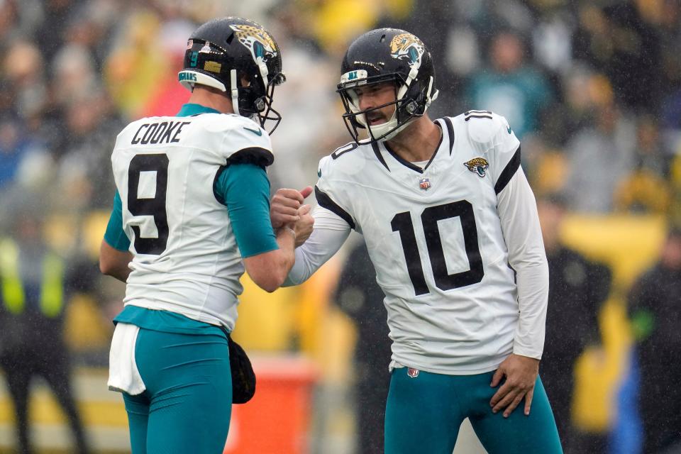 Jacksonville Jaguars' Brandon McManus (10) celebrates a successful field goal against the Pittsburgh Steelers with holder Logan Cooke (9). McManus is having a career season with 17 field goals in 19 attempts, while Cooke remains one of the NFL's top punters. The pair makes the Jaguars' special teams unit a legitimate force in winning games.