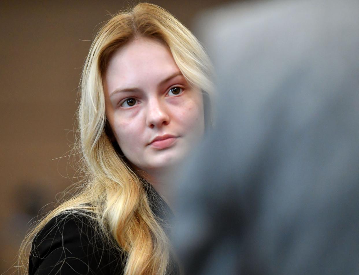 Maya Kowalski looks at her father, Jack Kowalski, during a break in proceedings, Thursday, Oct. 19, 2023 at the South County Courthouse in Venice, Florida. The Kowalski family is suing Johns Hopkins All Children's Hospital for false imprisonment, negligent infliction of emotional distress, medical negligence, battery, and other claims more than a year after the family matriarch, Beata Kowalski, took her life following allegations she was abusing her daughter, Maya Kowalski. Pool photo/Mike Lang/Sarasota Herald-Tribune