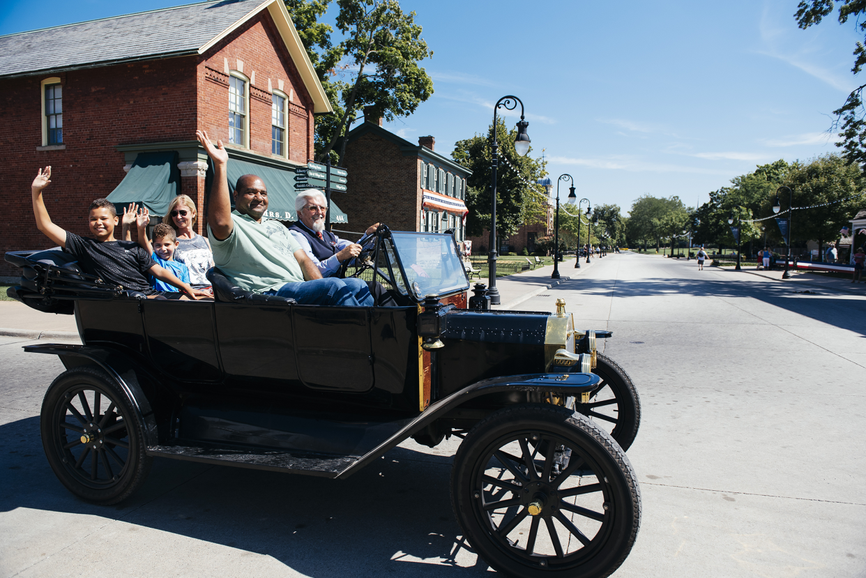 Visitor's cruising in an antique car at Greenfield Village in Dearborn.