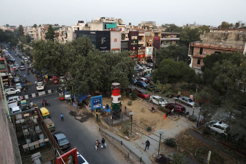 A "smog tower", a 20-feet-tall air-purifier, is seen at a market area in New Delhi