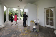 <p>A Secret Service agent unlocks a service entrance to the Oval Office as the West Wing of the White House in Washington, Friday, Aug. 11, 2017, as renovations continue while President Donald Trump is spending time at his golf resort in New Jersey. (AP Photo/J. Scott Applewhite) </p>