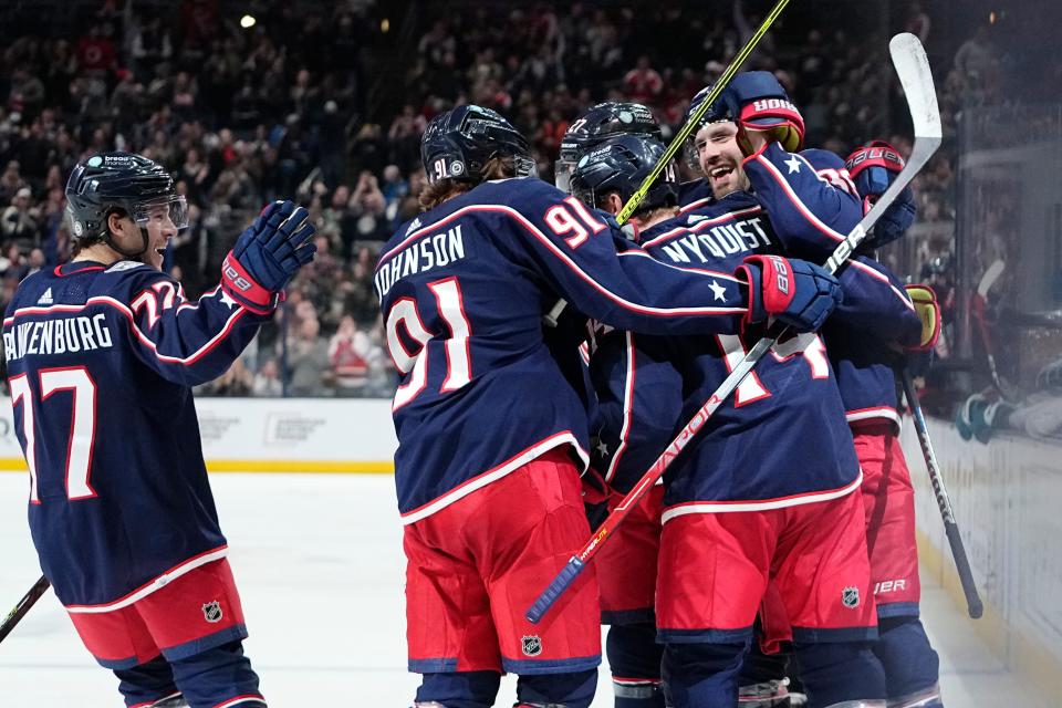 Jan 21, 2023; Columbus, Ohio, USA;  Teammates celebrate a goal by Columbus Blue Jackets left wing Gustav Nyquist (14) during the third period of the NHL hockey game against the San Jose Sharks at Nationwide Arena. The Blue Jackets won 5-3. Mandatory Credit: Adam Cairns-The Columbus Dispatch
