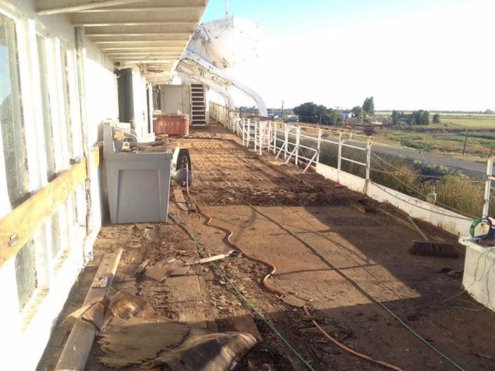 The promenade deck was filled with rotted wood and rusted steel.