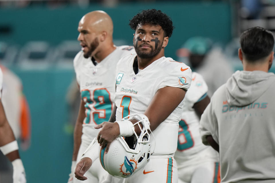 Miami Dolphins quarterback Tua Tagovailoa (1) looks up before NFL football game against the Buffalo Bills, Sunday, Jan. 7, 2024, in Miami Gardens, Fla. (AP Photo/Wilfredo Lee)