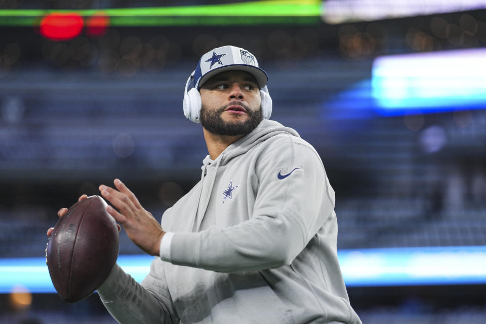 DALLAS, TX - JANUARY 14: Dak Prescott #4 of the Dallas Cowboys warms up prior to an NFL wild-card playoff football game against the Green Bay Packers at AT&T Stadium on January 14, 2024 in Dallas, Texas. (Photo by Cooper Neill/Getty Images)