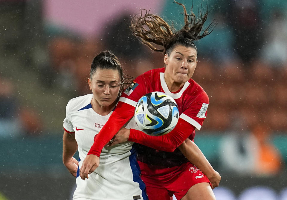 Norway's Vilde Boe Risa, left, fights for a high ball with Switzerland's Ramona Bachmann during the Women's World Cup Group A soccer match between Switzerland and Norway in Hamilton, New Zealand, Tuesday, July 25, 2023. (AP Photo/Abbie Parr)