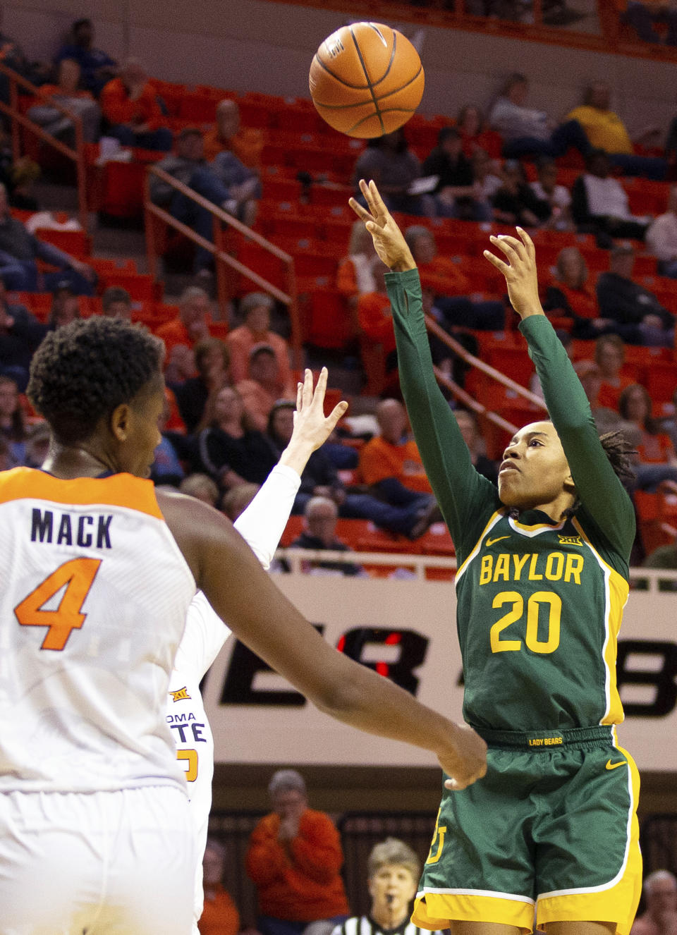 Oklahoma State forward Natasha Mack (4) watches as Baylor guard Juicy Landrum (20) shoots during the second half of an NCAA college basketball game in Stillwater, Okla., Saturday, Feb. 15, 2020. (AP Photo/Brody Schmidt)