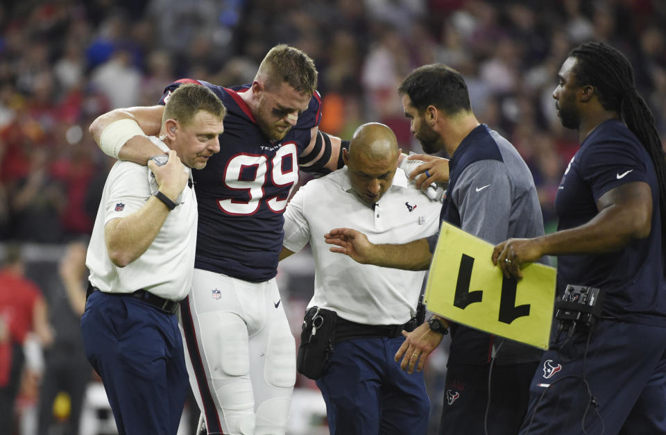 Houston Texans defensive end J.J. Watt (99) is helped off the field after an injury during the first half of an NFL football game Sunday, Oct. 7, 2017, in Houston. Hamstring pulls, ligament tears and ankle sprains can be as formidable an opponent for NFL teams as a high-scoring offense or stingy defense. (AP Photo/Eric Christian Smith)