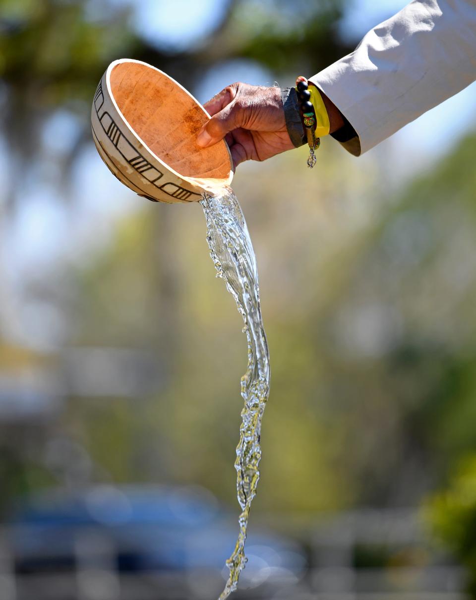 During the dedication Dr. James Stewart, of Sarasota, gave the libation ceremony, a ritual of pouring a water/liquid as an offering to a spirit, deity, or soul of the deceased victims of racial violence. Sarasota & Manatee Community Remembrance Project honored the victims of racial violence with a new historical marker site at Sarasota's Unitarian Universalist Church Saturday afternoon, Feb. 24, 2024.