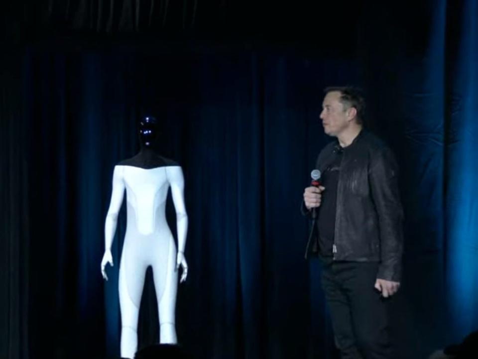 Elon Musk on stage with a mock-up version of Tesla’s humanoid robot in August, 2021 (Tesla)
