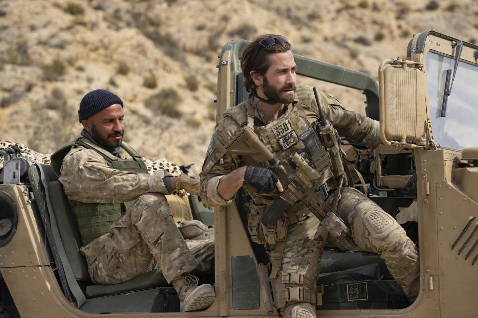 This image released by Metro Goldwyn Mayer Pictures shows Dar Salim as Ahmed, left, and Jake Gyllenhaal as Sgt. John Kinley in a scene from "Guy Ritchie's The Covenant." (Christopher Raphael/Metro Goldwyn Mayer Pictures via AP)