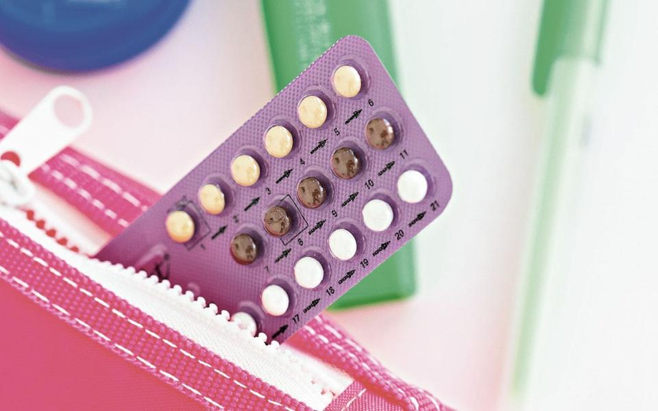 Contraceptive pills in a pink pencil case. - This content is subject to copyr