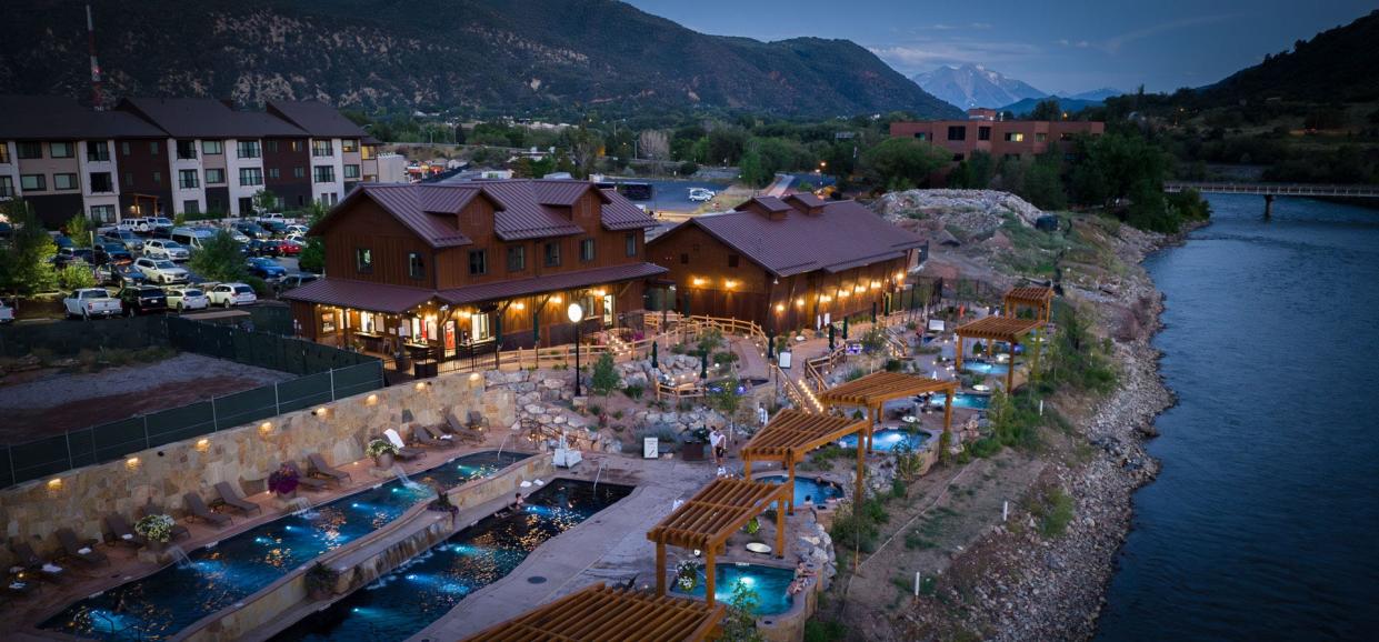 Guests can take in sweeping views of the surrounding mountains and river at Iron Mountain Hot Springs.