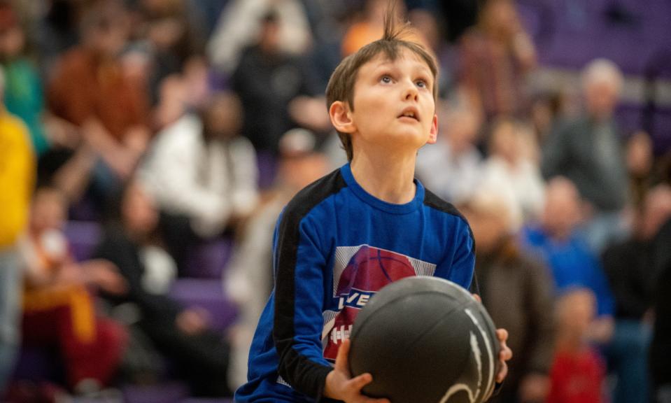 Klayton Hayes takes a shot with one of his new basketballs he received from the 44th News Journal All-Star Classic All-Stars. Hayes was the All-Star Poster Child this year as he receives services from Catalyst Life Services.