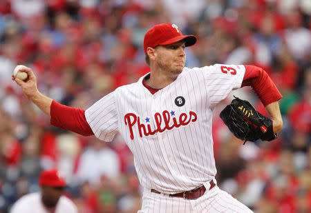 FILE PHOTO: Philadelphia Phillies starting pitcher Roy Halladay throws against the St. Louis Cardinals in the first inning of Game 1 of their MLB National League Divisional Series baseball playoffs in Philadelphia, October 1, 2011. REUTERS/Tim Shaffer/File photo